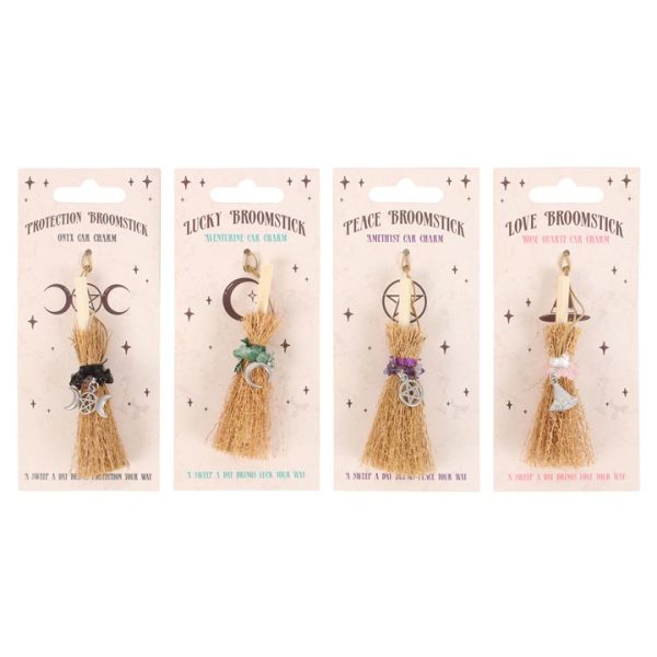 Set of 24 Lucky Crystal Broomstick Car Charms on Display - Image 3