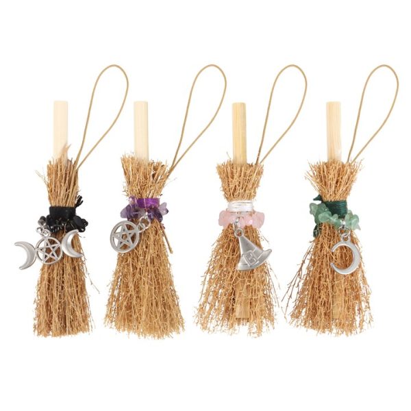 Set of 24 Lucky Crystal Broomstick Car Charms on Display - Image 4